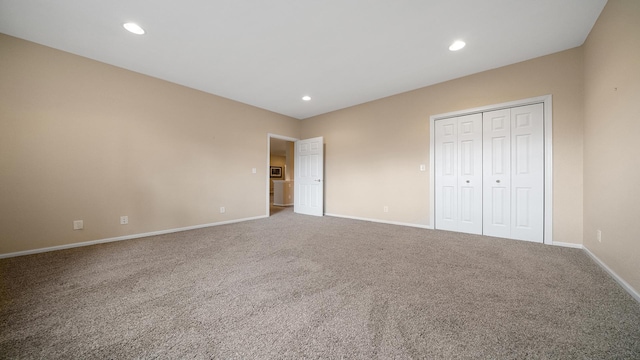 unfurnished bedroom with carpet flooring, recessed lighting, and baseboards