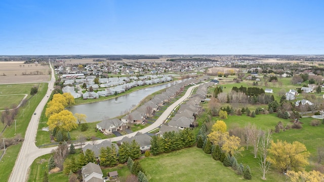 drone / aerial view featuring a water view and a residential view
