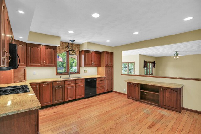 1801 Bentbrook Dr, Champaign, IL 61822 - kitchen with black appliances, baseboards, a sink, light wood-type flooring, and recessed lighting