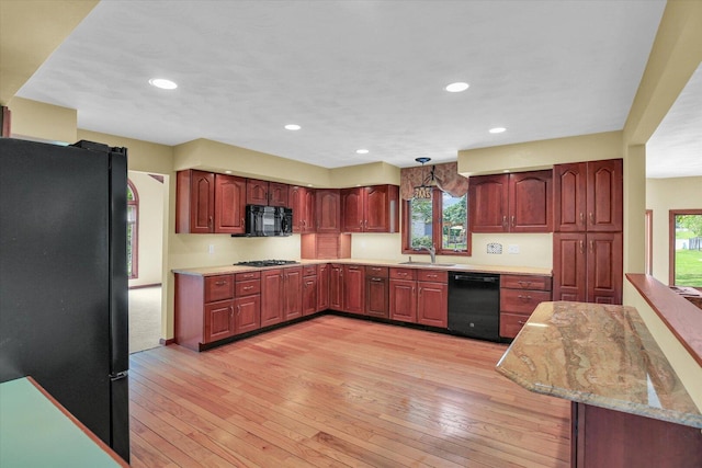 1801 Bentbrook Dr, Champaign, IL 61822 - kitchen with black appliances, a sink, plenty of natural light, light wood-style flooring, and recessed lighting