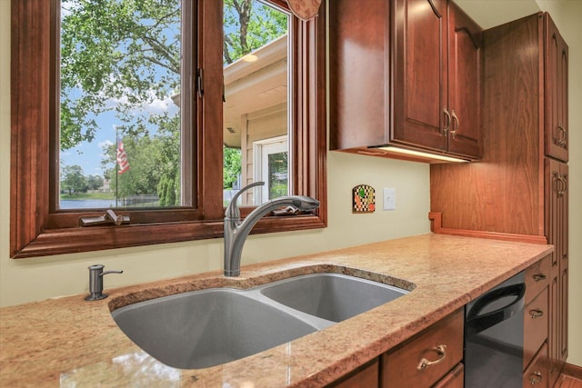 1801 Bentbrook Dr, Champaign, IL 61822 - kitchen with a sink, black dishwasher, and light stone countertops