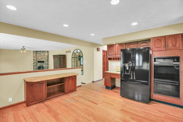 1801 Bentbrook Dr, Champaign, IL 61822 - kitchen with black appliances, baseboards, light wood-style floors, open shelves, and a fireplace