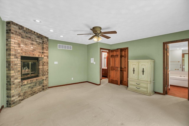 1801 Bentbrook Dr, Champaign, IL 61822 - unfurnished bedroom with baseboards, light colored carpet, a fireplace, ensuite bathroom, and recessed lighting