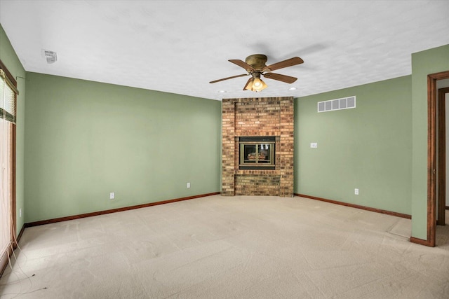 1801 Bentbrook Dr, Champaign, IL 61822 - unfurnished living room with ceiling fan, light colored carpet, a fireplace, and baseboards