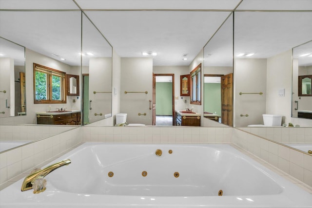 1801 Bentbrook Dr, Champaign, IL 61822 - bathroom featuring toilet, a whirlpool tub, and vanity