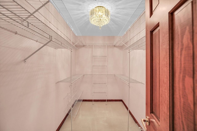 1801 Bentbrook Dr, Champaign, IL 61822 - walk in closet featuring a chandelier