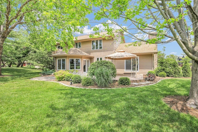 1801 Bentbrook Dr, Champaign, IL 61822 - back of property with a lawn and a gazebo