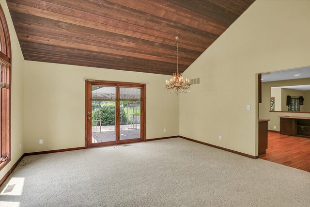 1801 Bentbrook Dr, Champaign, IL 61822 - carpeted spare room with wood ceiling, a chandelier, baseboards, and high vaulted ceiling