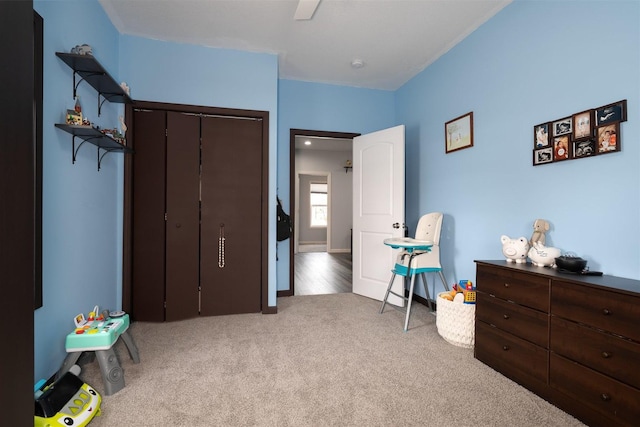 carpeted bedroom featuring a closet