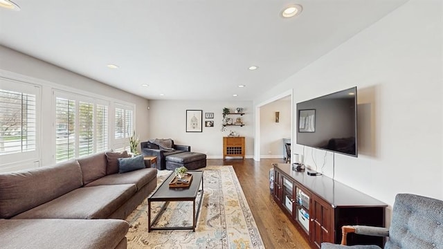 living area featuring recessed lighting, wood finished floors, and baseboards