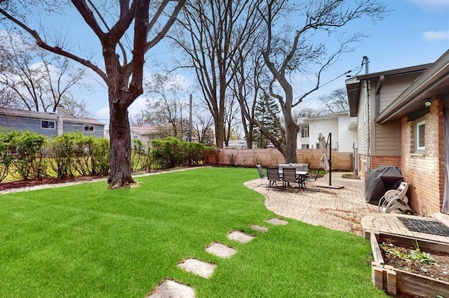 view of yard featuring a fenced backyard and a patio area