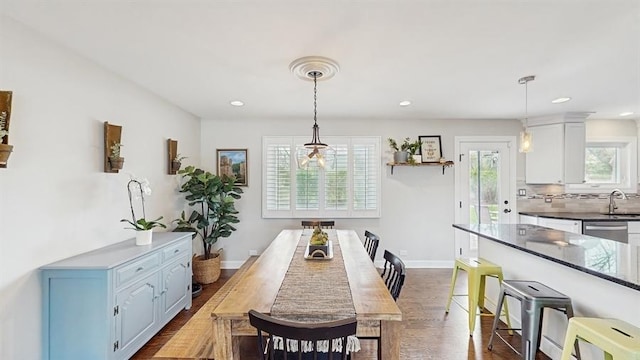 dining area with recessed lighting, baseboards, and dark wood finished floors