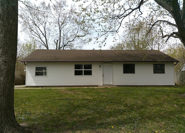 1507 Thornton Dr, Champaign, IL 61821 - ranch-style home with a front lawn and fence
