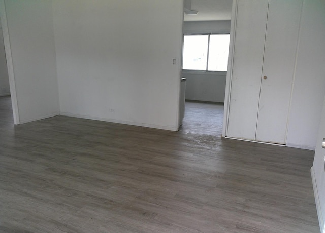 1507 Thornton Dr, Champaign, IL 61821 - unfurnished room featuring wood finished floors and baseboards