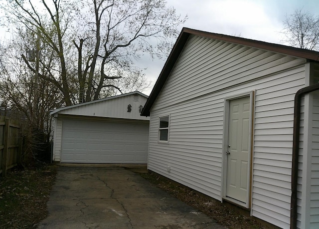 1507 Thornton Dr, Champaign, IL 61821 - view of home's exterior with an outdoor structure and a garage