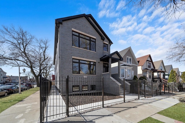2200 N Kildare Ave, Chicago, IL 60639 - view of front facade with brick siding, a residential view, and a fenced front yard