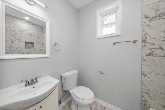 2200 N Kildare Ave, Chicago, IL 60639 - bathroom featuring toilet, marble finish floor, baseboards, and vanity