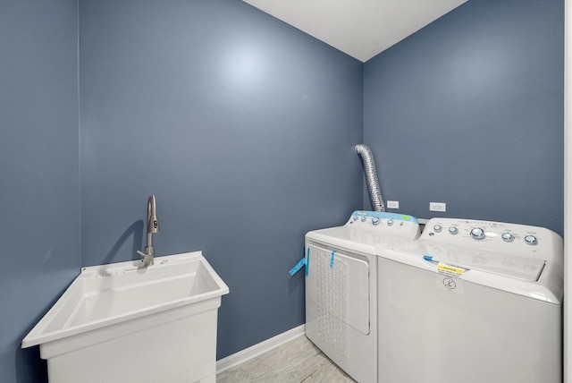 2200 N Kildare Ave, Chicago, IL 60639 - laundry area featuring a sink, independent washer and dryer, laundry area, and baseboards