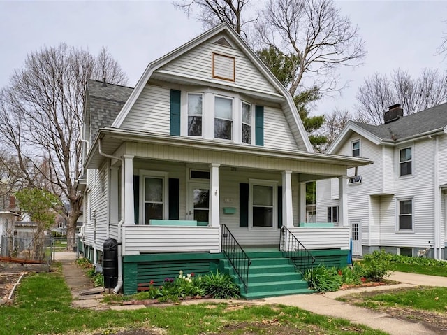 1910 E Taylor St, Bloomington, IL 61701 - dutch colonial featuring a gambrel roof and a porch