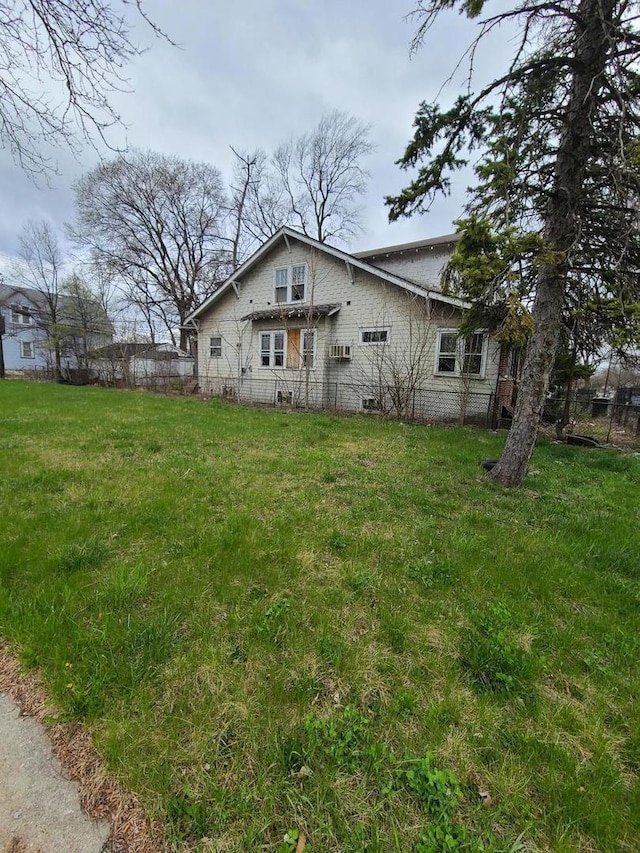 10452 S State St, Chicago, IL 60628 - view of side of property with a lawn