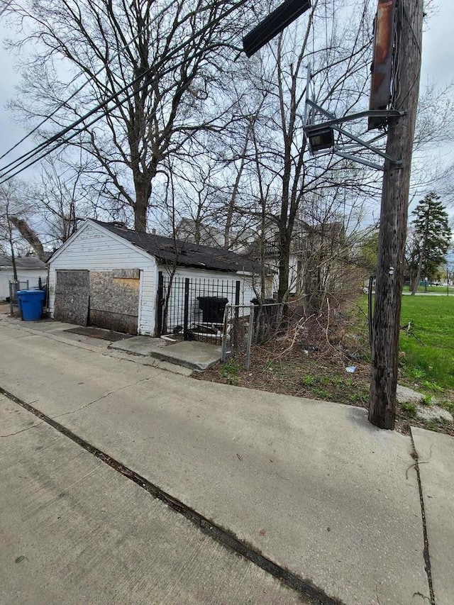 10452 S State St, Chicago, IL 60628 - exterior space with an outdoor structure and a garage