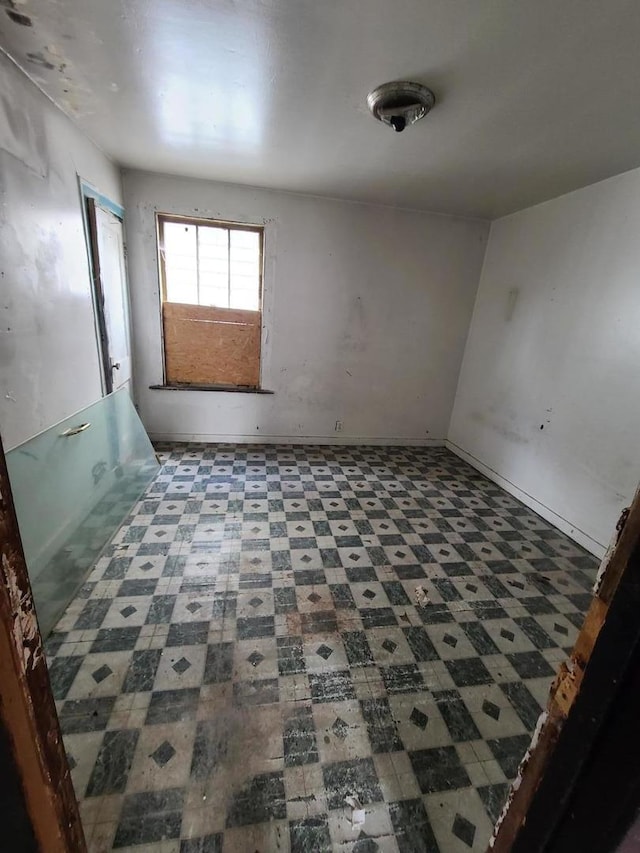 10452 S State St, Chicago, IL 60628 - unfurnished room with tile patterned floors
