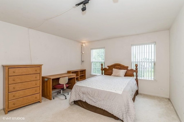 bedroom featuring carpet flooring and baseboards