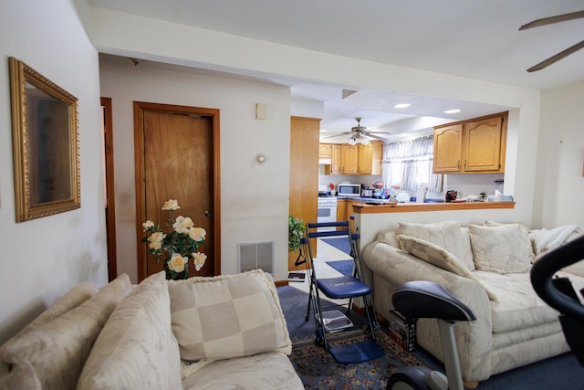 living room featuring recessed lighting, visible vents, and a ceiling fan