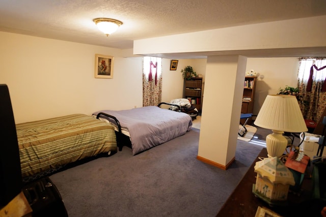 carpeted bedroom with a textured ceiling