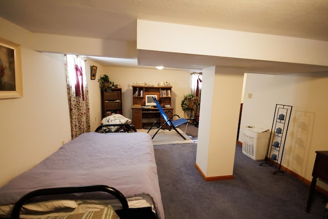 bedroom with dark carpet and baseboards