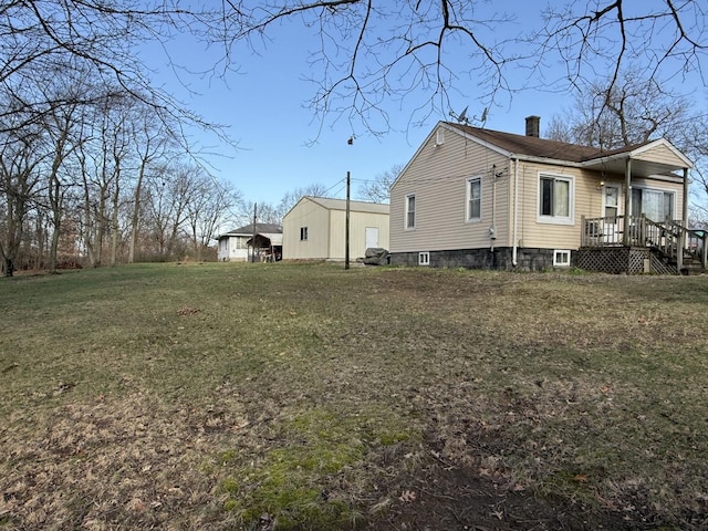 view of property exterior with a chimney and a lawn