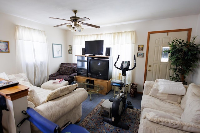 living room with a ceiling fan and carpet floors