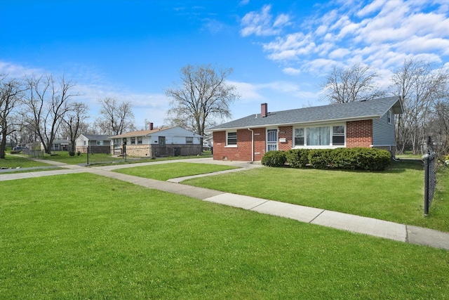 2708 Oxford Dr, Markham, IL 60426 - view of front of property featuring a chimney, fence, concrete driveway, brick siding, and a front yard
