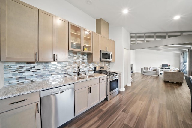 2708 Oxford Dr, Markham, IL 60426 - kitchen featuring stainless steel appliances, a sink, decorative backsplash, glass insert cabinets, and open floor plan