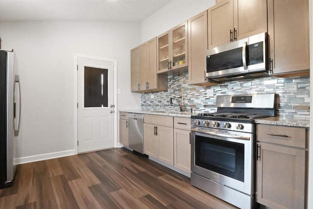 2708 Oxford Dr, Markham, IL 60426 - kitchen featuring stainless steel appliances, a sink, tasteful backsplash, dark wood finished floors, and glass insert cabinets