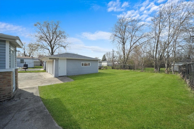 2708 Oxford Dr, Markham, IL 60426 - view of yard featuring a fenced backyard, driveway, an outbuilding, a patio, and a garage