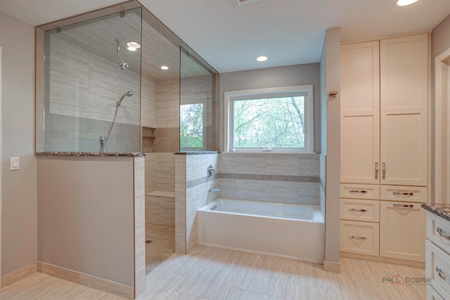 16737 W Cherrywood Ln, Wadsworth, IL 60083 - bathroom featuring a walk in shower, recessed lighting, vanity, and a garden tub