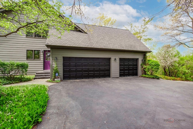 16737 W Cherrywood Ln, Wadsworth, IL 60083 - exterior space featuring an attached garage, driveway, and roof with shingles