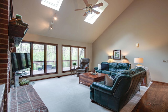 16737 W Cherrywood Ln, Wadsworth, IL 60083 - living area with a skylight, high vaulted ceiling, baseboards, and a ceiling fan