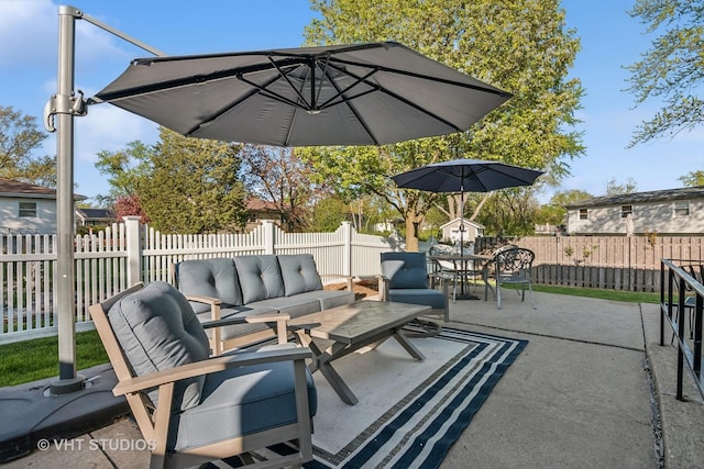 view of patio with outdoor dining space, outdoor lounge area, and a fenced backyard