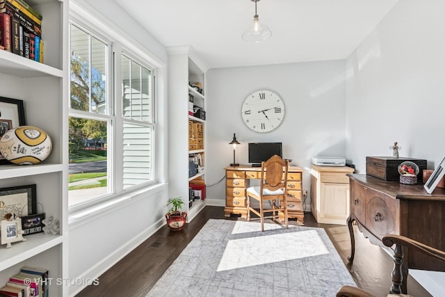 office area with dark wood-style floors and baseboards