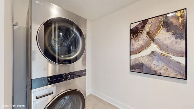 405 Filson St, La Grange, IL 60525 - laundry room with laundry area, baseboards, stacked washing maching and dryer, and tile patterned flooring
