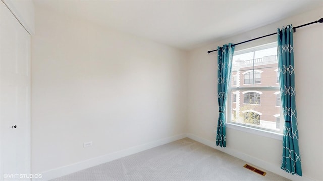 405 Filson St, La Grange, IL 60525 - spare room featuring carpet floors, baseboards, and visible vents