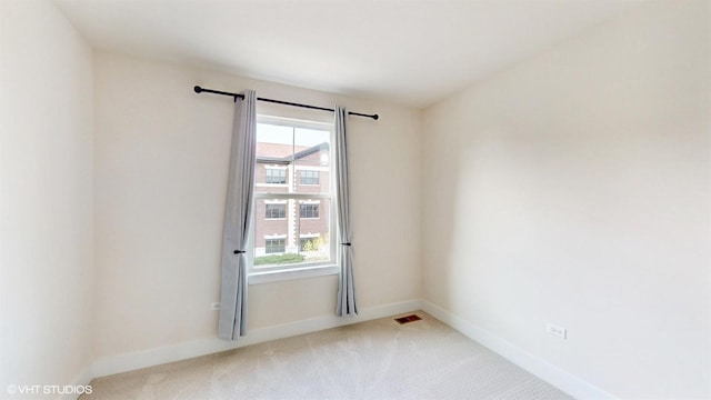 405 Filson St, La Grange, IL 60525 - carpeted empty room with visible vents, baseboards, and a healthy amount of sunlight