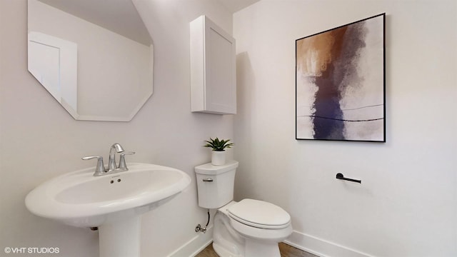 405 Filson St, La Grange, IL 60525 - half bathroom featuring a sink, baseboards, and toilet