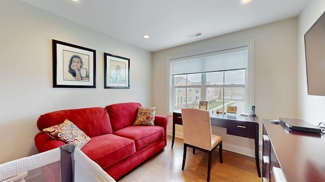 office area featuring light wood finished floors, baseboards, visible vents, and recessed lighting