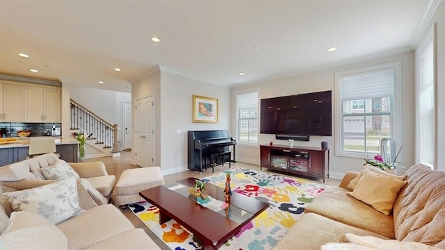 living area with crown molding, stairs, baseboards, and recessed lighting