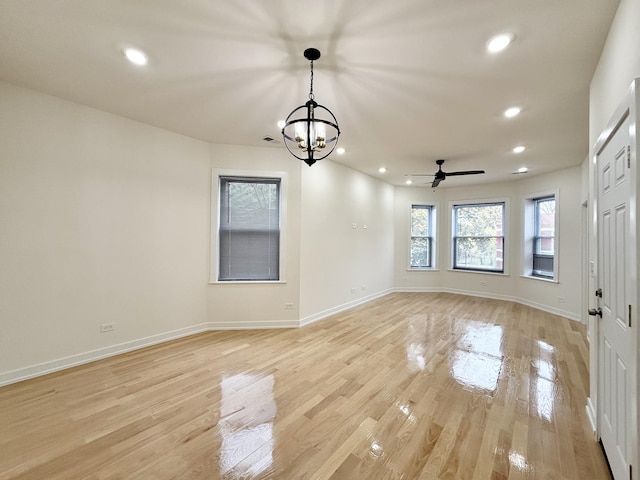 unfurnished dining area featuring recessed lighting, light wood-type flooring, and baseboards