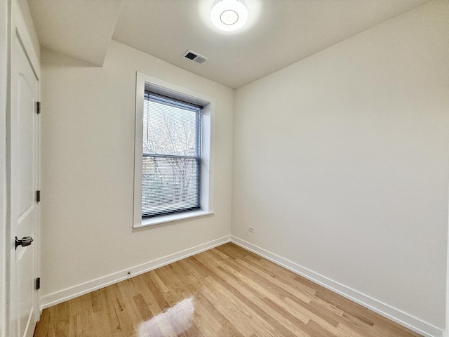 interior space with visible vents, light wood-type flooring, and baseboards
