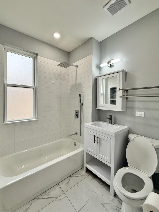 full bath featuring vanity, bathing tub / shower combination, toilet, visible vents, and marble finish floor